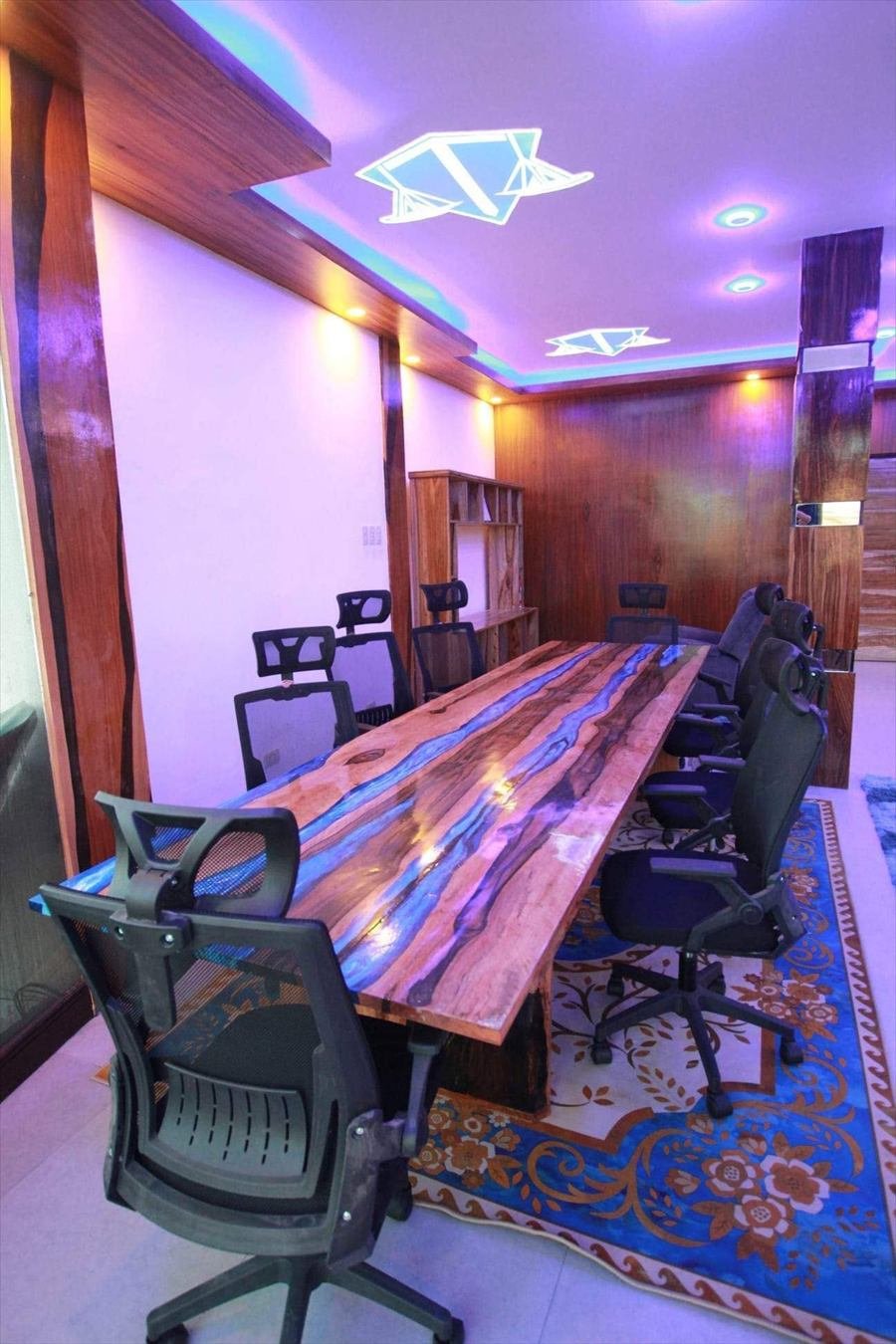 Conference room with a live-edge resin table at the TLG Pampanga branch