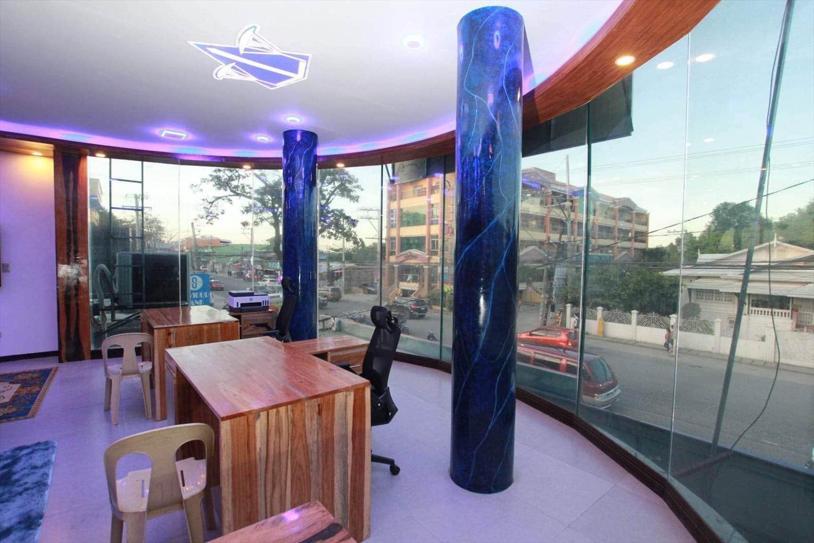 Glass-walled office floor overlooking MacArthur Highway