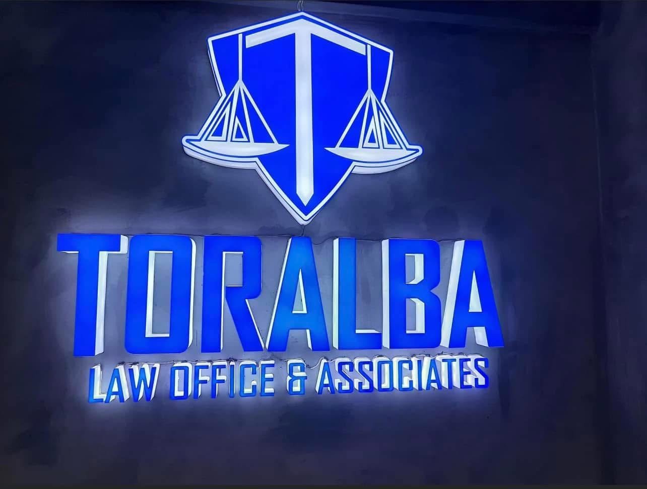 Illuminated Toralba Law Office & Associates sign at the TLG Concepcion branch